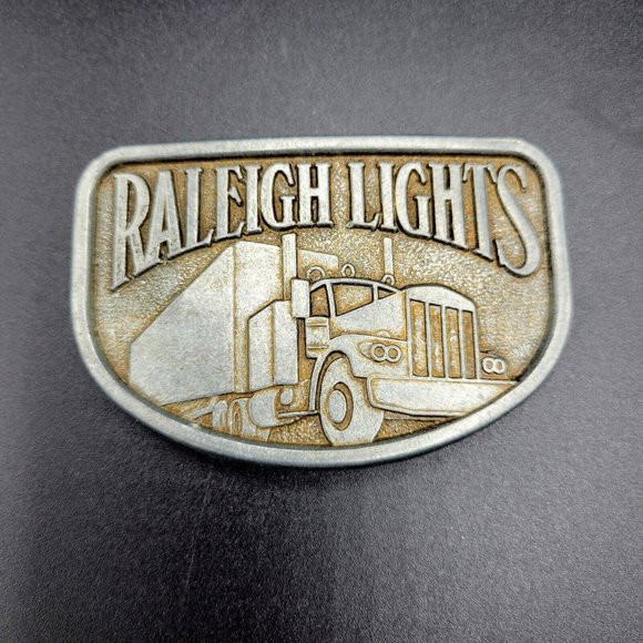 Vintage Raleigh Lights Metal Men's Belt Buckle  3"x2" 18W Truck - Picture 1 of 6